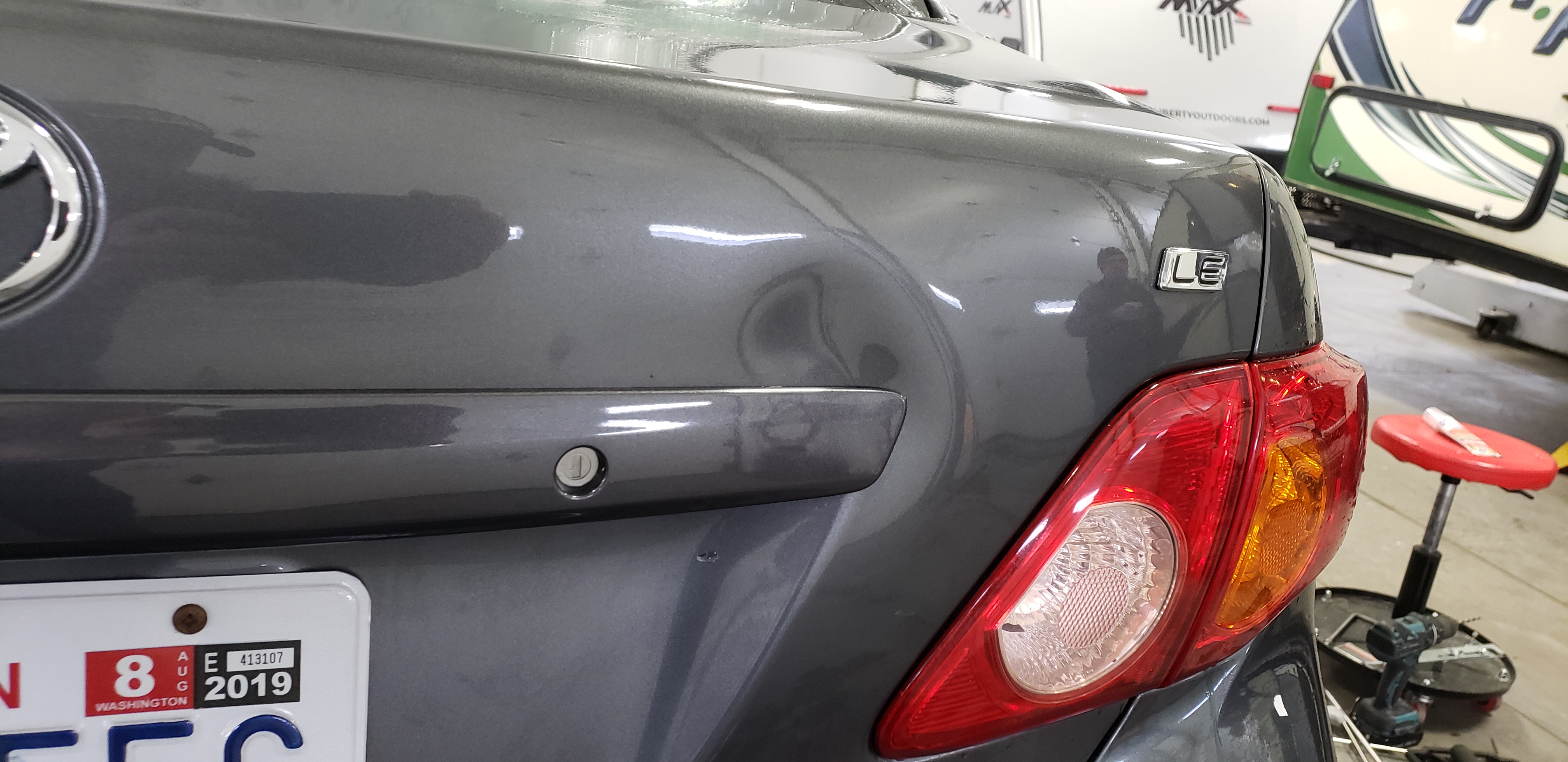 Dark front fender before paintless dent repair
