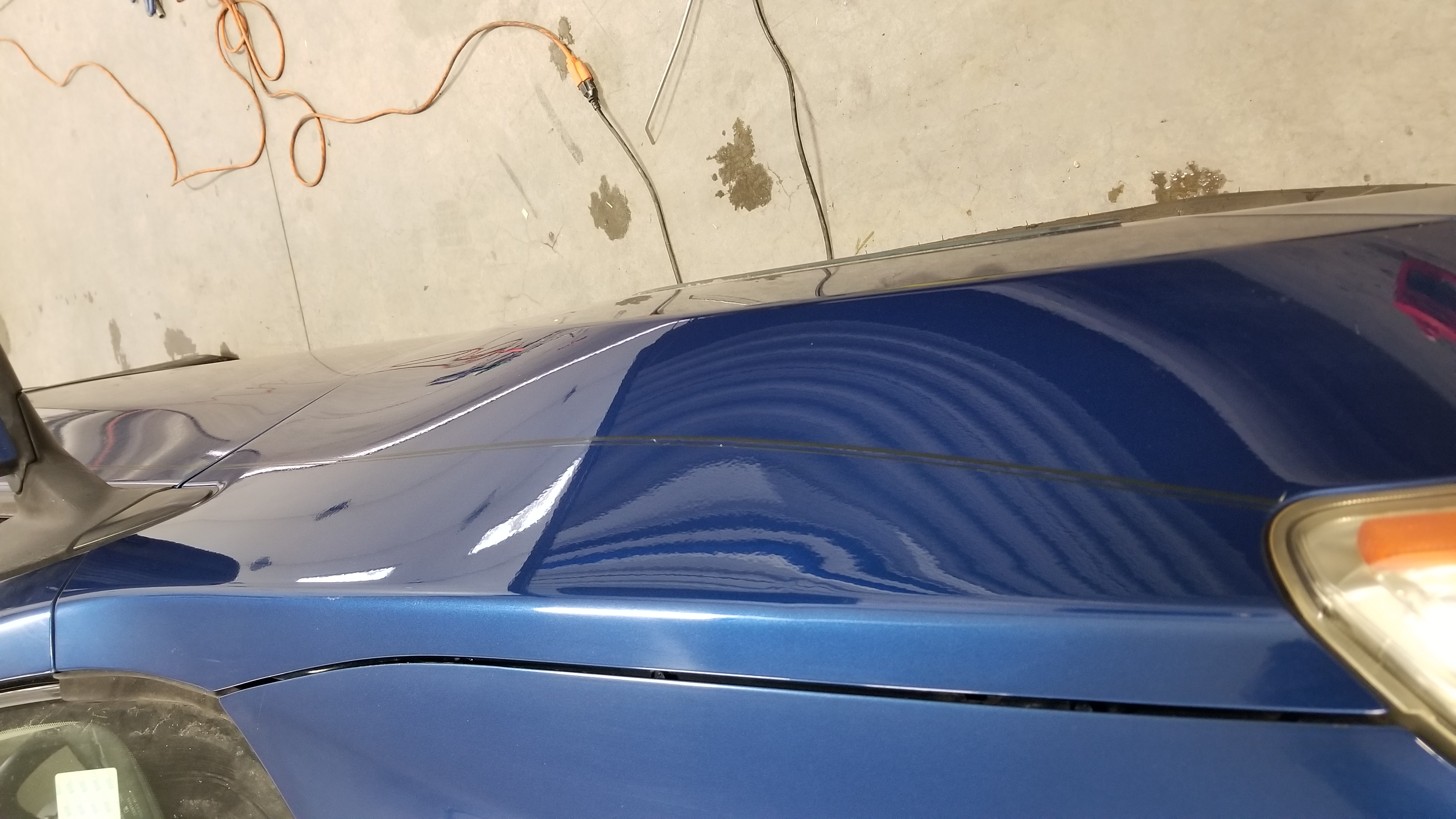 Blue hood after paintless dent repair