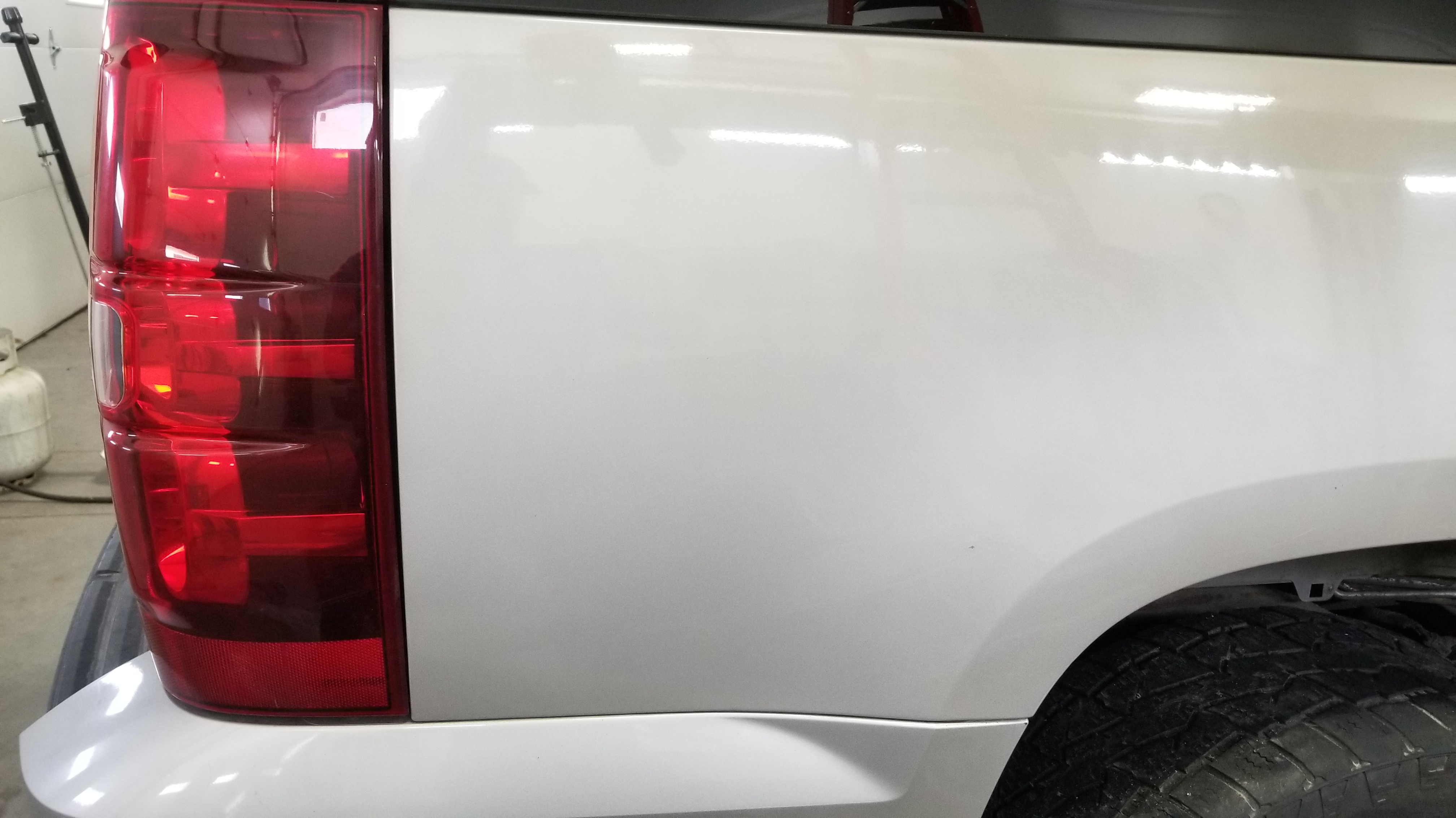 Blue truck fender after paintless dent repair