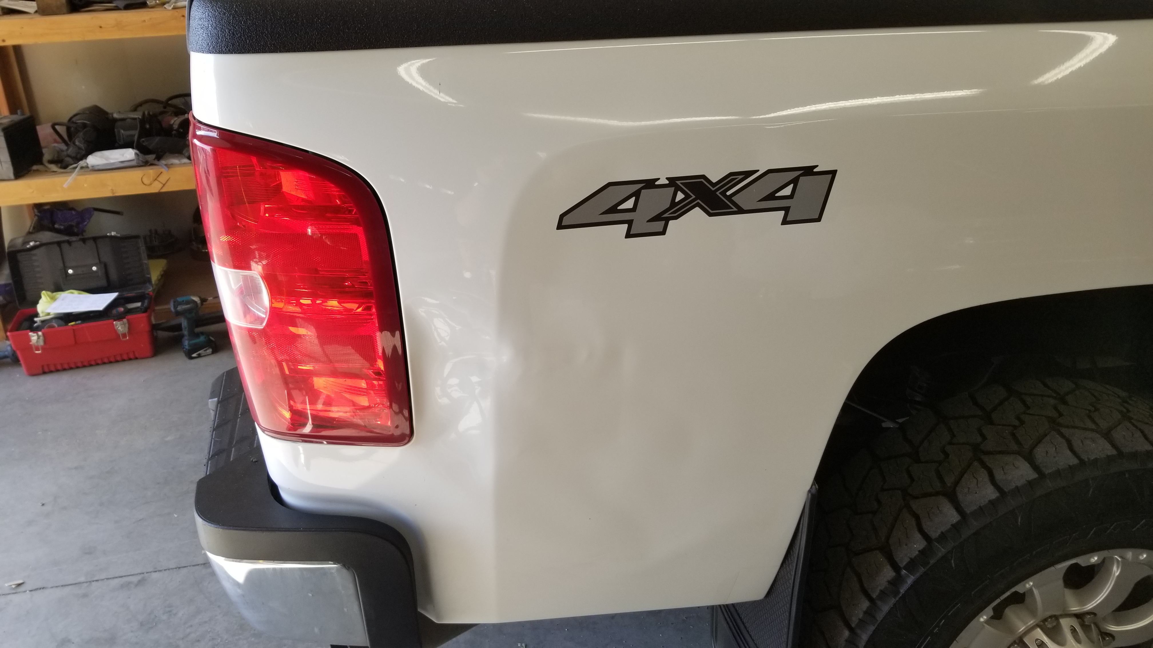 Gray fender crease before paintless dent repair