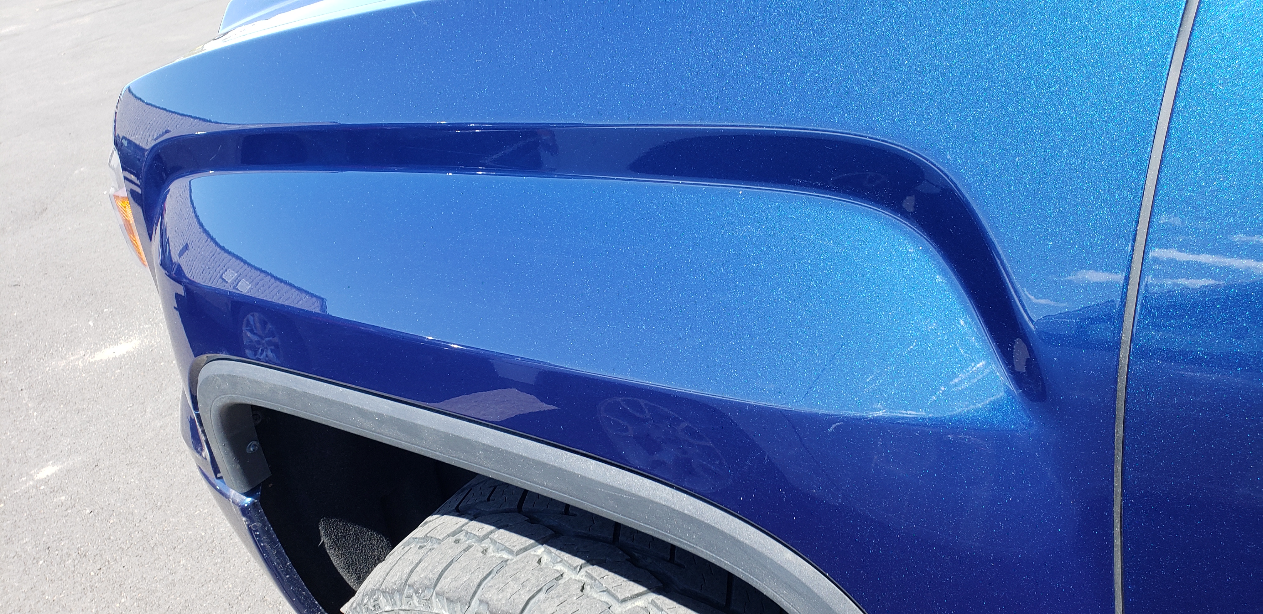 Gray hatch panel after paintless dent repair
