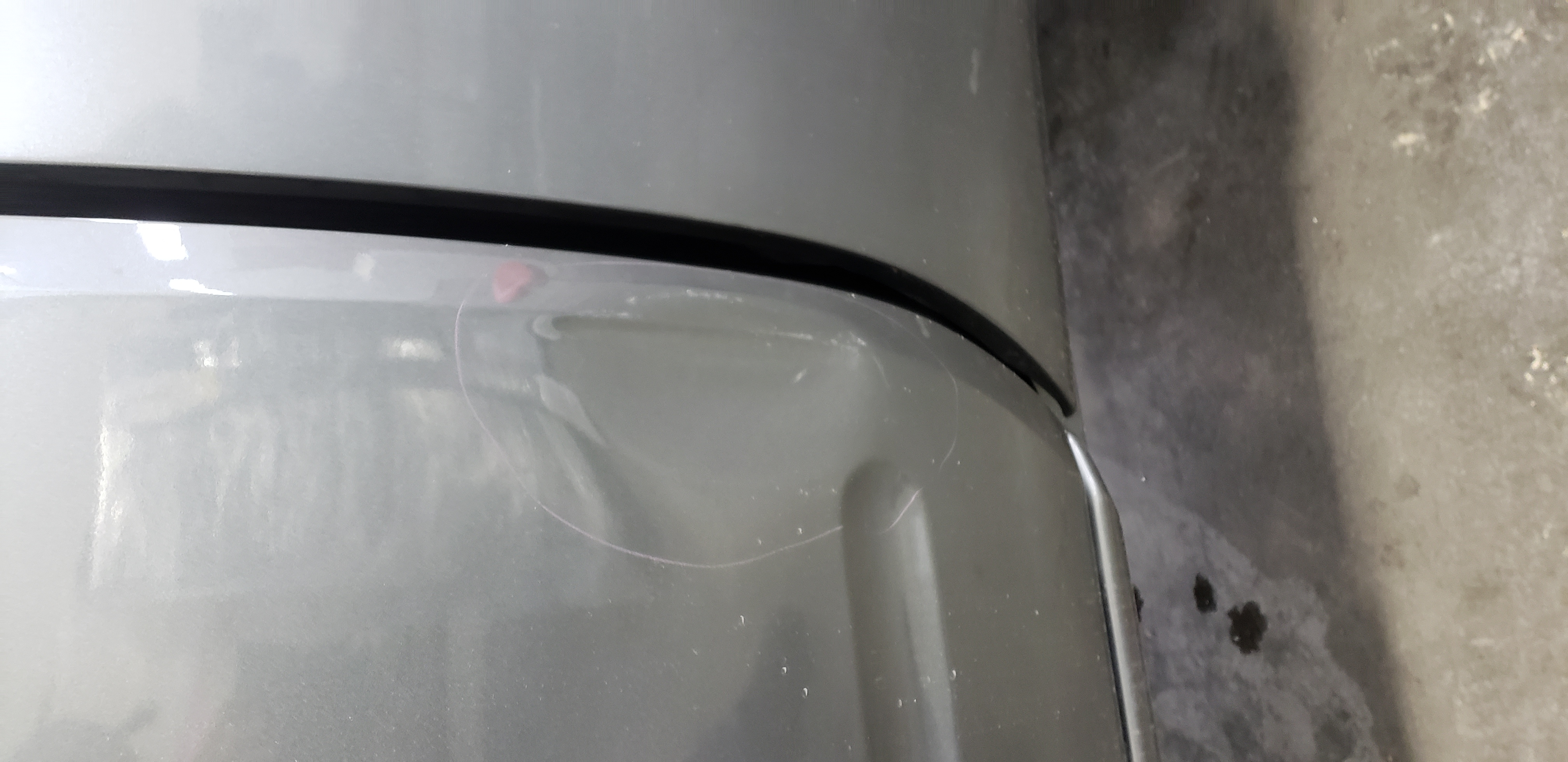 Gray quarter panel before paintless dent repair