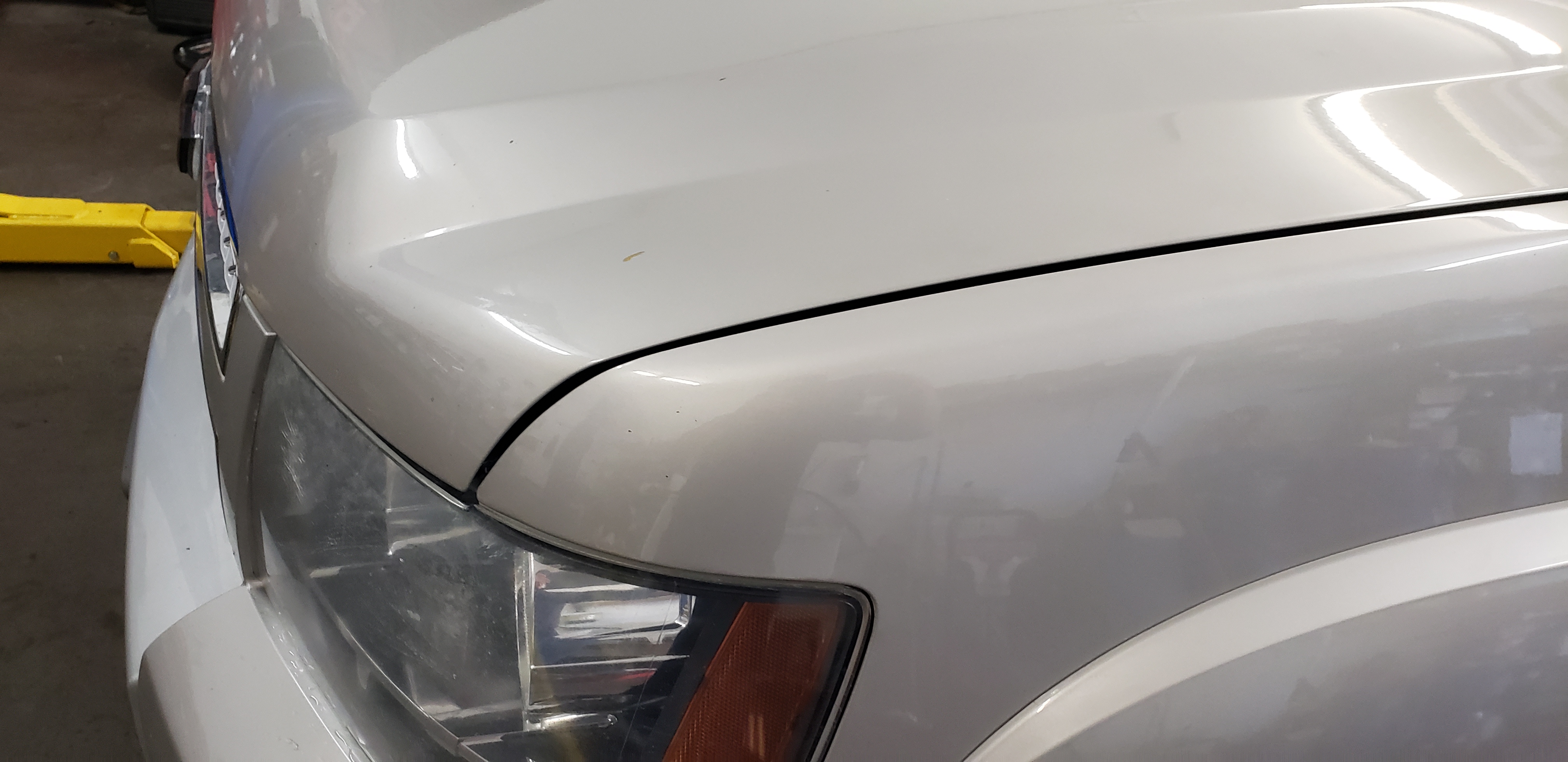 White hood after paintless dent repair