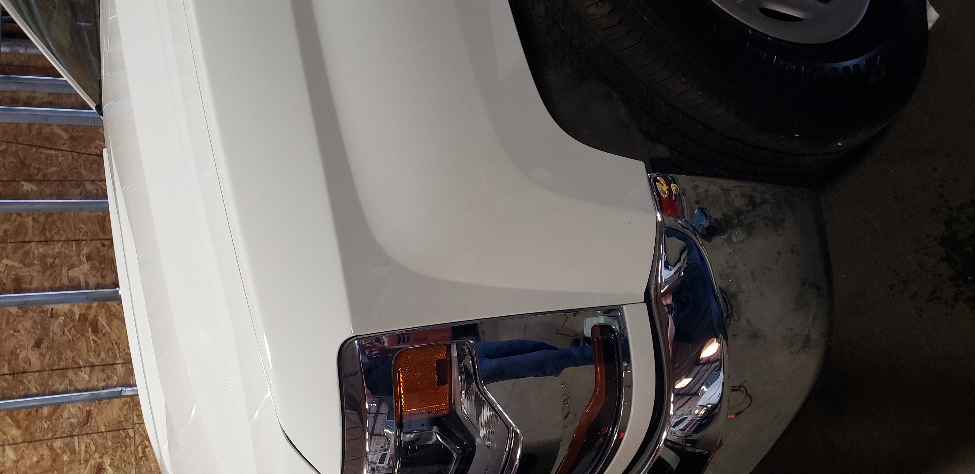 White front fender after paintless dent repair