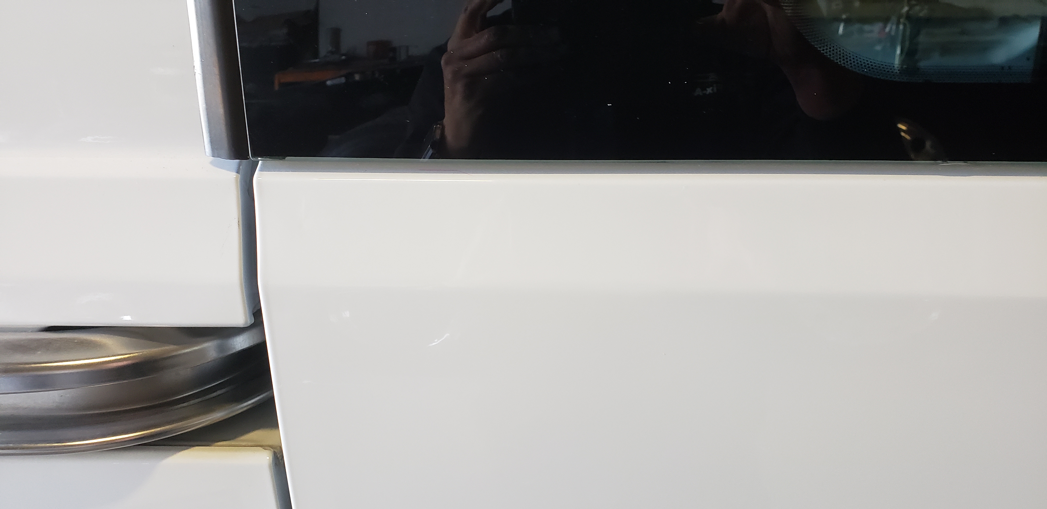 White van panel after paintless dent repair