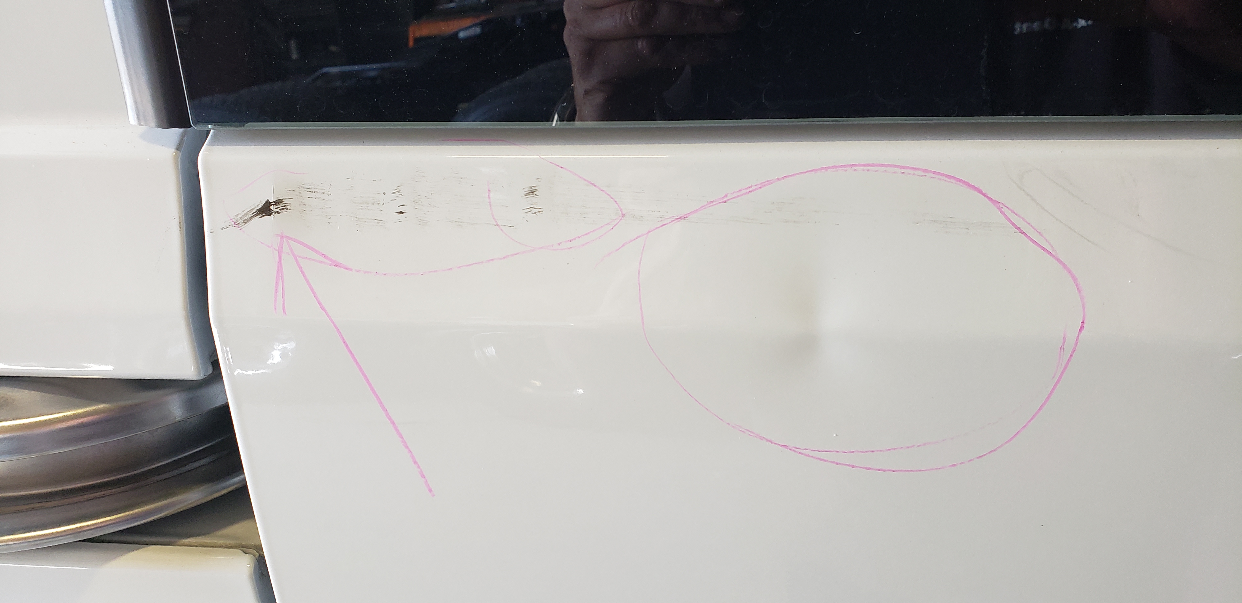 White van panel before paintless dent repair