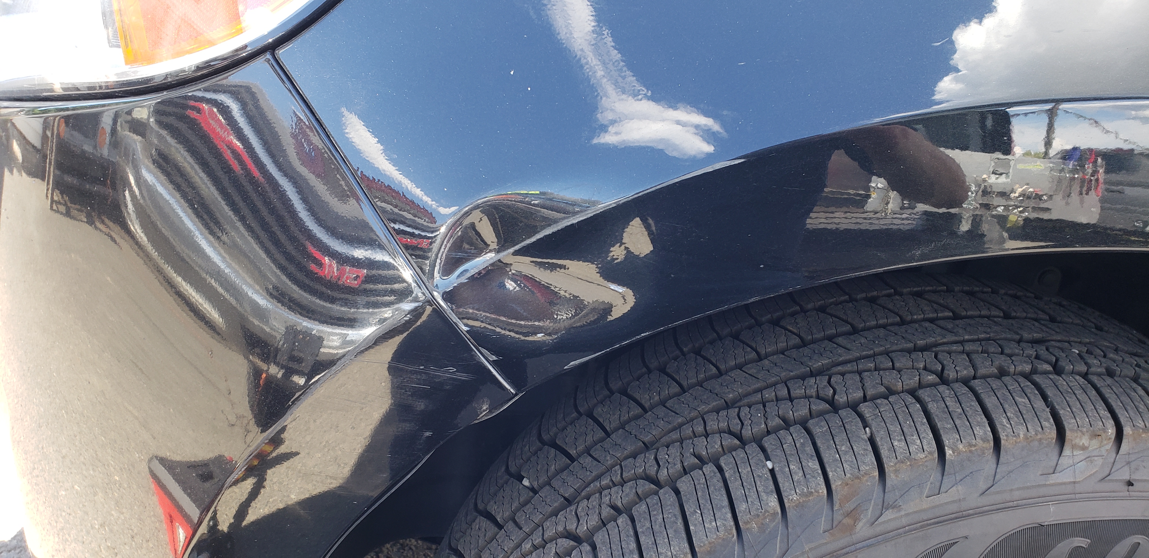 Dent shown with reflection board before paintless dent repair